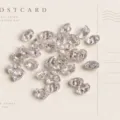 Clear glass double hole shaped beads for DIY jewelry making, bracelets, and necklaces. - 10g (Approx 110 Beads) / Crystal Clear