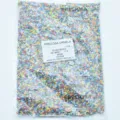 Detailed shot of Preciosa multi-colored glass seed beads in a transparent package. - 2.0-2.2mm / 11-00008