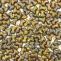 Close-up detail of T-shaped bone glass beads, vintage yellow and green glazed DIY charms. - Yellow Green Vintage Glaze