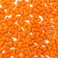 Detailed close-up shot of vibrant orange glass T-bone beads, showcasing glossy texture. - Orange