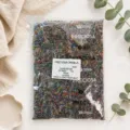 Detailed close-up shot of colorful Czech glass seed beads inside transparent package. - 2.2-2.4mm / 10-00006