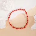 Handcrafted red heart beaded bracelet with gold spacer beads, stylish minimalist jewelry for women. - Red