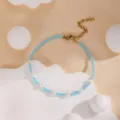 Bracelet de perles de rocaille bleues fait main avec chaîne dorée réglable pour l'été. - Bleu clair
