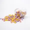 Colorful octagonal wax seal beads set in a clear jar for DIY craft letters wedding invites. - Bottled Wax Beads - Floral Field