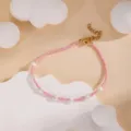 Minimalist handmade pink seed bead and pearl bracelet detail closeup showing delicate gold clasp. - Pink