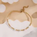Elegant gold beaded bracelet with white pearls, adjustable chain, delicate design for summer style. - Gold