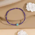Blue seed bead bracelet with gold spacers and turquoise stone, minimalist style for daily wear. - Style 13