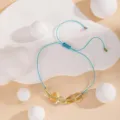 Bracelet artisanal en cordon bleu avec pierres semi-précieuses jaunes irrégulières réglable. - 9#