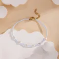 Handmade blue beaded bracelet with white pearl charms and gold adjustable extension chain. - Light Blue