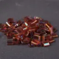 Miyuki TILA square two-hole glass seed beads in transparent amber iridescence color 10g - 10.00g / TILA-256