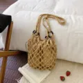 Beige macrame woven hobo bucket bag with top handle and inner drawstring pouch design. - Khaki