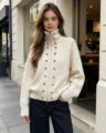 Women's off-white knitted zip cardigan detail, featuring high collar and metal button accents. - One Size / Tops / Apricot