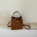 Brown suede bucket bag with top handle and metal lock closure, stylish chic shoulder bag. - Yellowish Brown (No Charm) / 17*11*17