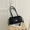 Classic black leather shoulder bag with chic diamond quilting and metal turn-lock for daily commute. - 32*12*15 / Off White