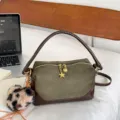 Green suede pillow handbag with brown leather trim, star pendant and leopard furry charm. - Green