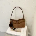 Brown suede shoulder bag stylish casual handbag with fluffy pom-pom charm for women. - Brown