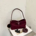 Burgundy suede shoulder bag with chic fur ball charm, casual elegant handbag for daily wear. - Burgundy