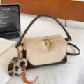 Chic beige and brown pillow shoulder bag with fluffy leopard charm, stylish commuter handbag. - Khaki