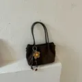 Brown suede minimalist shoulder tote bag with cute flower pendant, casual retro handbag style. - Coffee