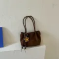 Brown suede tote bag for women, minimalist retro casual shoulder bag with cute flower pendant. - Brown