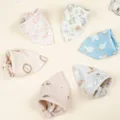 Detailed close-up of soft double-layer cotton gauze baby bibs featuring cute print designs. - Random Color