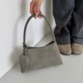 Grey suede shoulder bag for women, minimalist underarm handbag with small charm pouch. - Gray