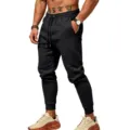 Men black sweatpants detail view, elastic drawstring waist and cuffed hem for daily wear. - S / Bottoms / Black