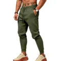 Detailed view of men solid color sweatpants with elastic drawstring waist and cuffed hem. - Army Green