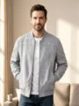 Gray suede bomber jacket detail view, featuring front zipper and ribbed hem. Ideal for casual wear. - S / Tops / Light Gray