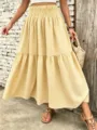 Detailed close-up of yellow gingham tiered maxi skirt with elastic waist and stylish design. - S / Bottoms / Yellow