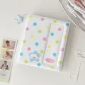 Detail view of Korean style polka dot photocard binder with cute star charm and pocket slot. - White
