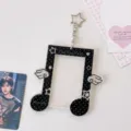 Acrylic star photocard holder featuring cute music note design and decorative pendant for fans. - Black and White