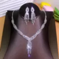 Close-up detail of the sparkling rhinestone tassel necklace and matching earrings jewelry set. - Pave Rhinestone Tassel Style (TL071)