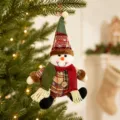 Christmas plush snowman doll hanging ornament with knitted hat and scarf for holiday decor detail. - Sitting Snowman
