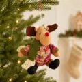 Cute Christmas reindeer plush hanging ornament with plaid shirt and green scarf for tree decor. - Sitting Reindeer