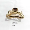 Gold metal hair claw clip detail, hollow geometric design, elegant hair accessory. - 8cm Size / Gold
