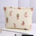 Korean style quilted cosmetic pouch with cute cartoon bear pattern, large capacity zipper bag. - Bear