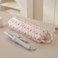 Borsa portaoggetti cilindrica trapuntata con ferro arricciacapelli per viaggi e cura dei capelli - Fiocco Rosa