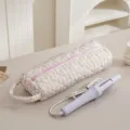 Borsa di stoccaggio trapuntata a fiori con zip rosa e pratico ferro arricciacapelli viola. - Piccolo Floreale Fortunato