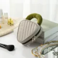 Quilted triangle cosmetic bag with padded handle, portable makeup pouch for daily storage. - Soda Color-Block Small Brown