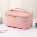 Pink woven travel cosmetic bag with large capacity, portable makeup storage pouch and golden zipper. - Sakura Pink