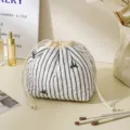 Cute striped quilted cosmetic bag with drawstring closure, portable travel storage pouch for daily use. - Drawstring Bag / Striped Black
