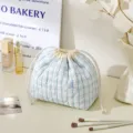 Blue plaid quilted cosmetic bag, cute drawstring pouch for travel and daily makeup storage. - Drawstring Bag / Light Blue Plaid