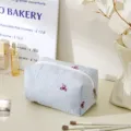 Blue striped quilted cosmetic bag with cute bow embroidery, portable travel makeup pouch. - Octagon Style / Striped Red