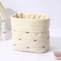 Cute quilted bow cosmetic bag, large capacity portable storage pouch for daily travel use. - Beige Coffee Bow