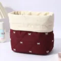 Maroon quilted cosmetic bag featuring white bowknot and canvas roll-top storage pouch. - Angola Red White Bow