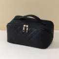 Black quilted cosmetic bag, large capacity portable makeup organizer for travel and daily use. - Black