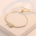 Pulsera ajustable dorada con diseño de girasol y piedras de circonita brillante. - Pulsera Ajustable de Girasol (TS0197) / Dorado