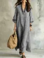 Detailed view of the black and white plaid maxi dress with v-neck and lantern sleeves. - S / Dresses / Black