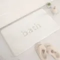 Thick absorbent bath mat with embossed letter design, non-slip floor rug for bathroom home use - 40x60cm / Off White